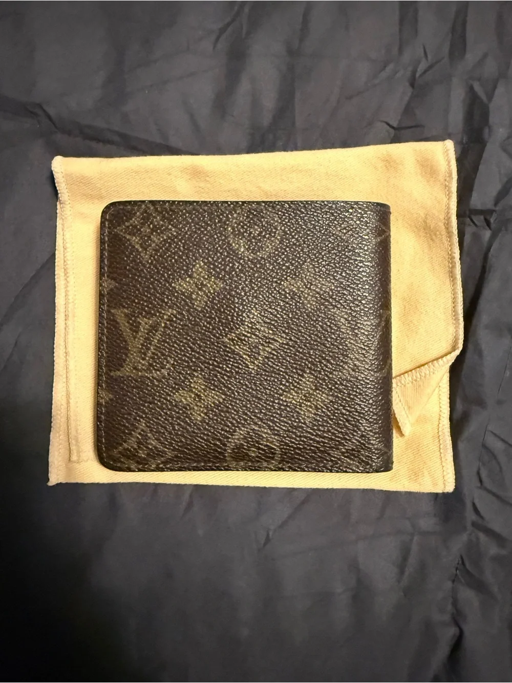 Louis Vuitton authentic Monogram Canvas Bi-Fold Wallet in Brown and Tan